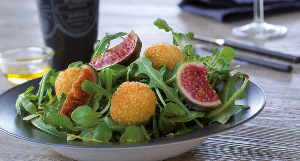 Mixed Leaf Salad with Figs and Mozzarella Fritters sprinkled with Crispy Parma Ham and Pistachio Nuts