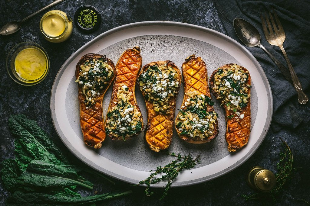 Mustard and Maple-Glazed Butternut Squash Stuffed With Farro and Winter Greens