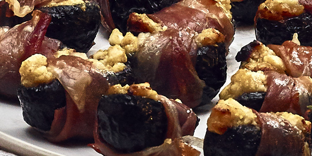 Prunes Filled With Goats Cheese and Maille Dijon Mustard, Wrapped In Parma Ham